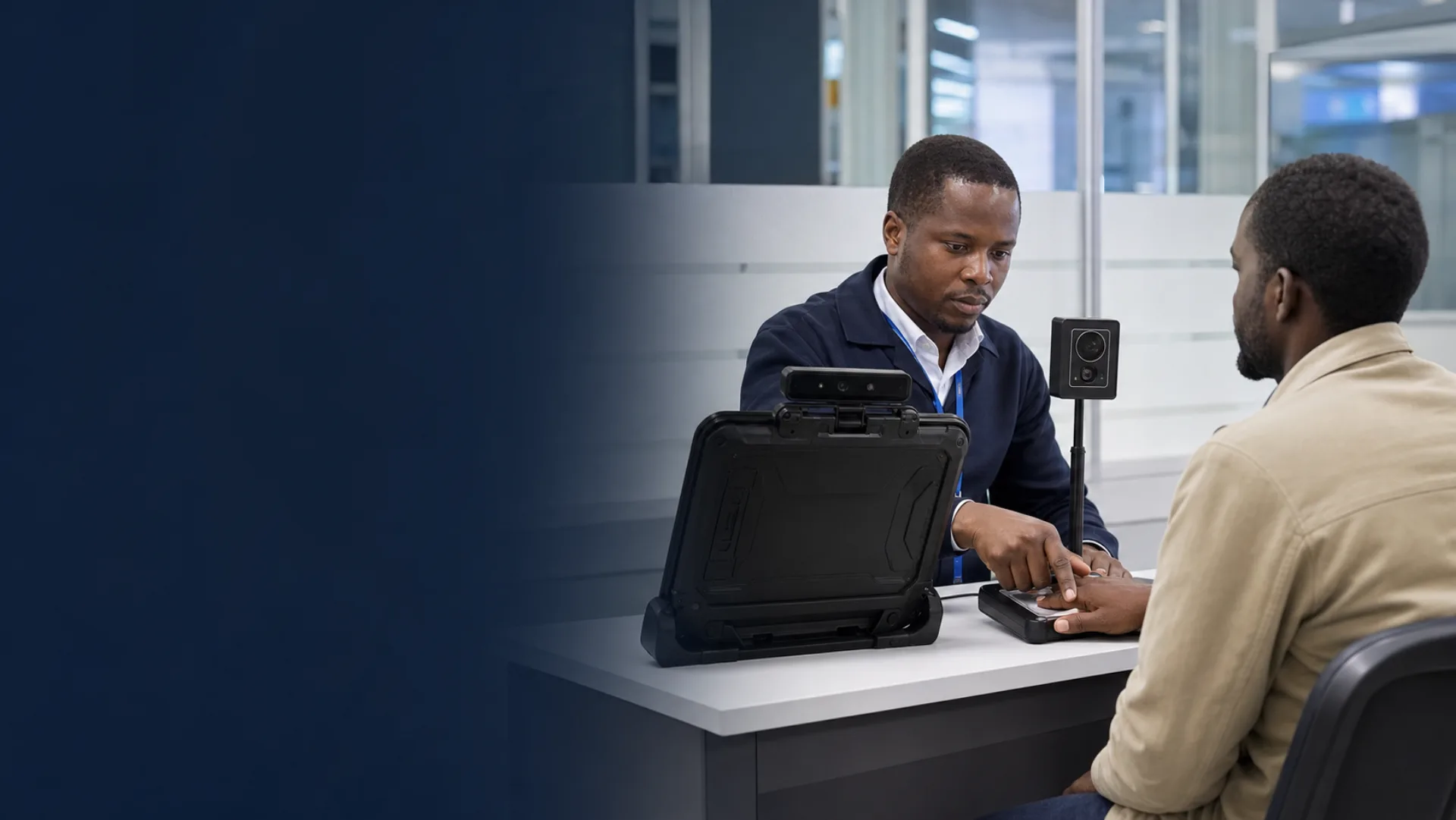 Officer supporting a citizen through biometric enrolment